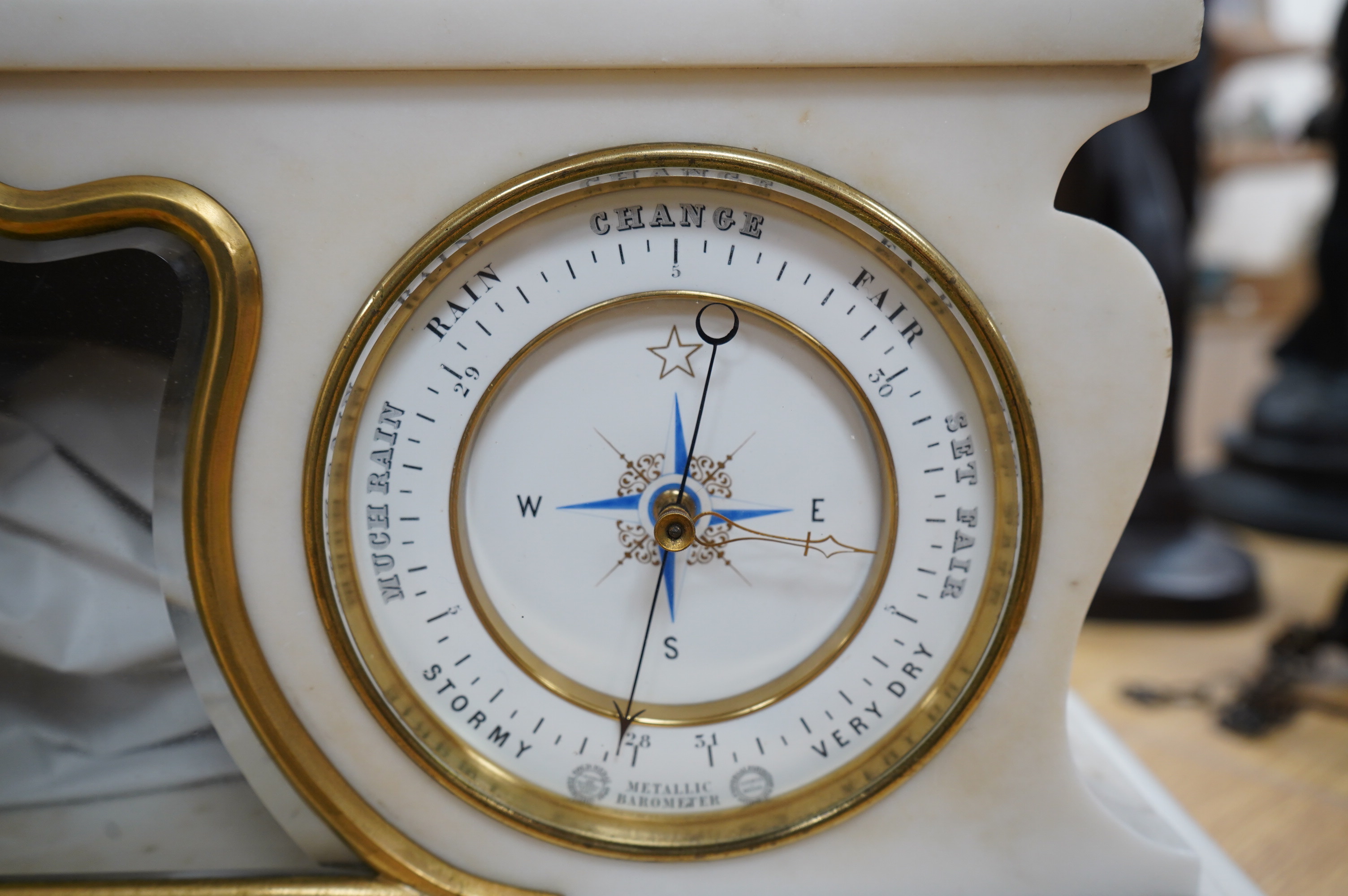 A good late 19th century white marble combination mantel clock, calendar and barometer, with sweep seconds hand, 52cm wide. Condition - fair to good